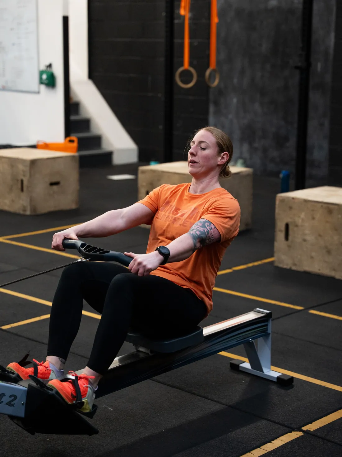 A member rowing on a Concept2 during the warm-up