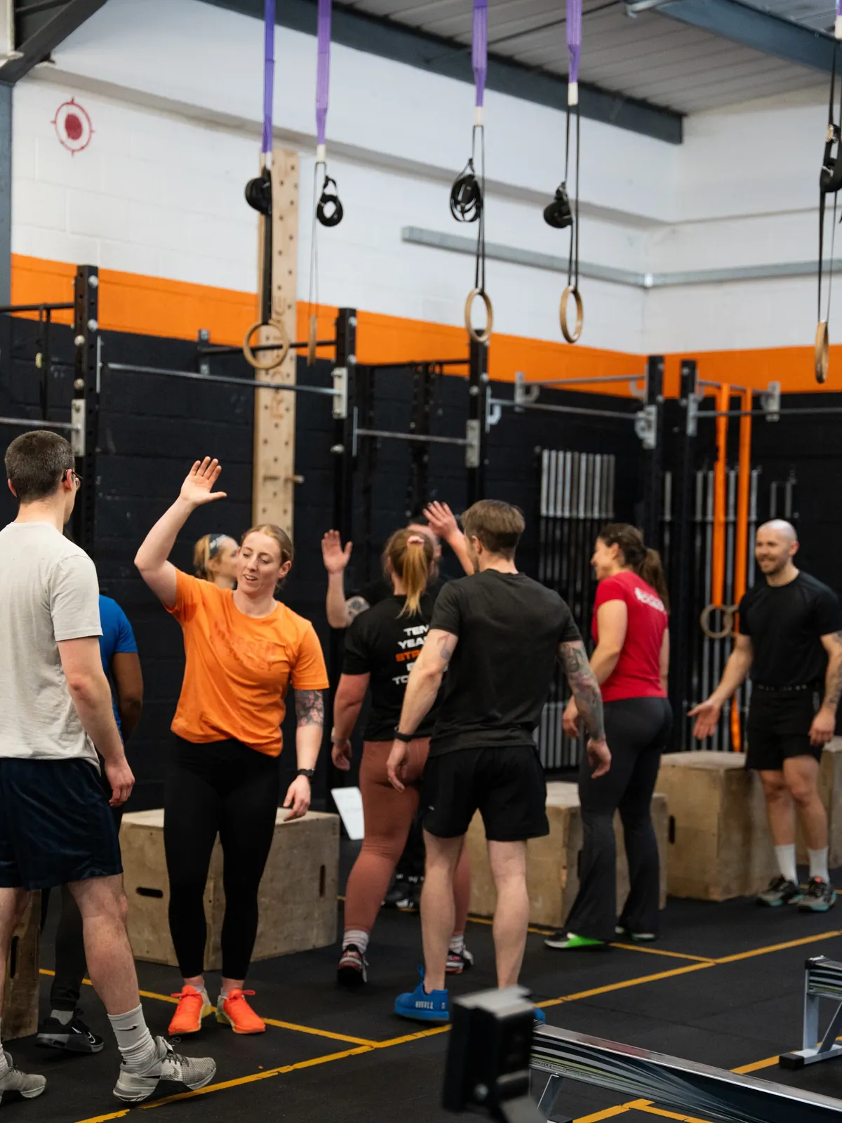 Members high-fiving at the end of a class at CrossFit Bletchley